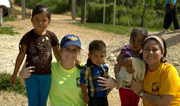 SonLight Power volunteers with smiling children