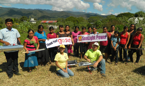 Mexicans holding 'Thank you' banner with SonLight Power team