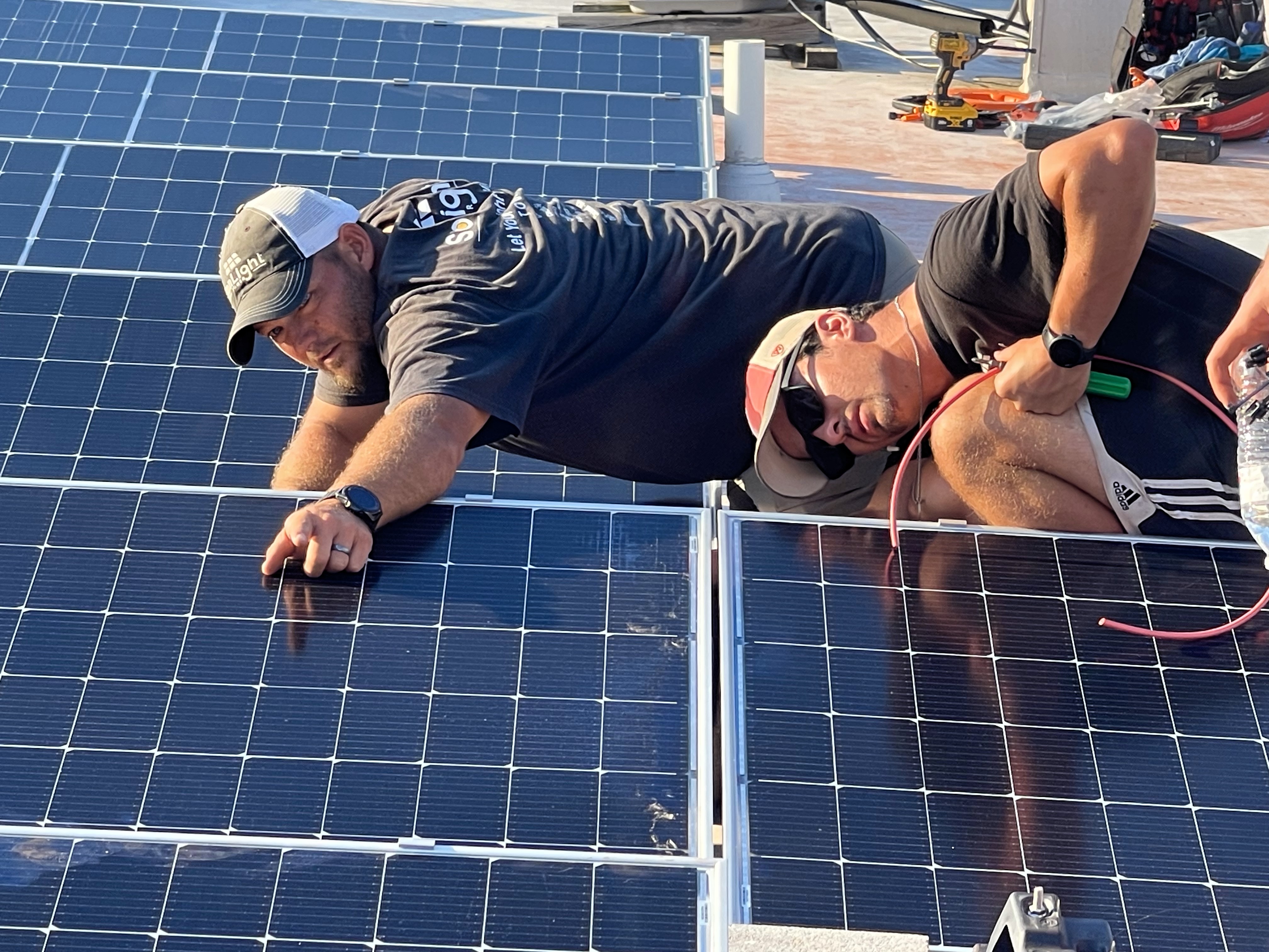 Lydia's House Clay & Colin examine straightness of solar array 01b