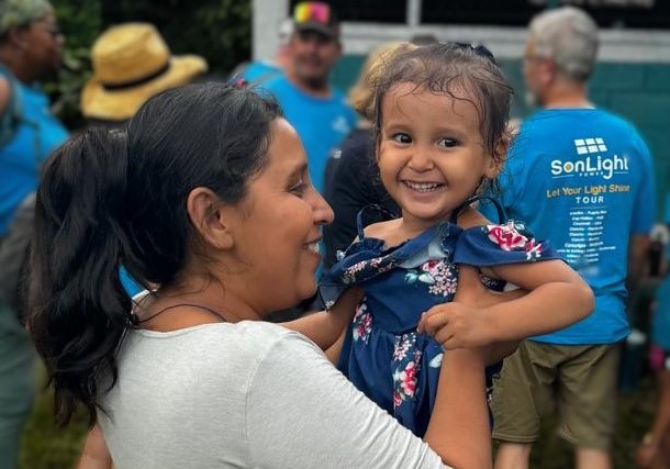 2024 Donor Impact woman holding toddler