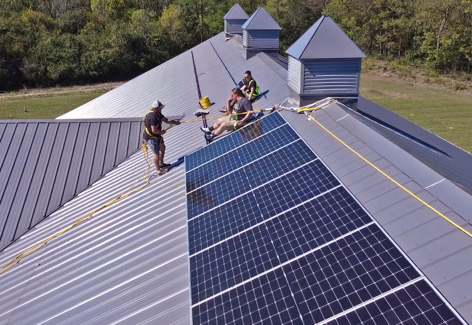 Horses on the Hill - team installing panels on roof